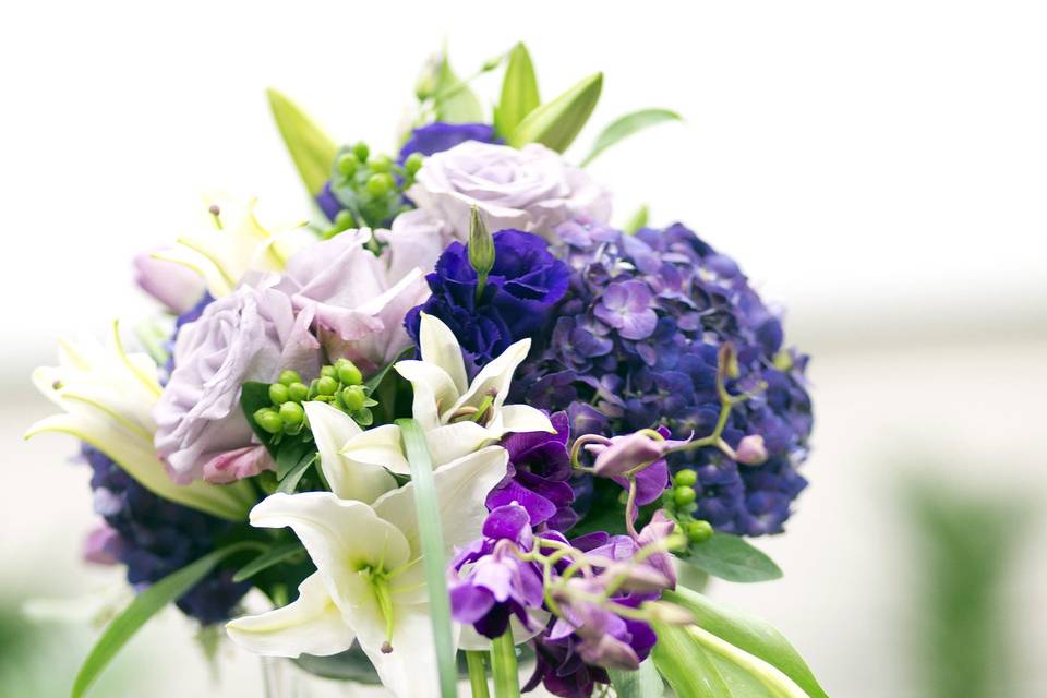 Purple hydrangea with orchids and tulips