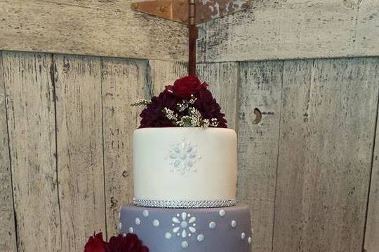 All fondant cake with chocolate jewels and fresh flowers