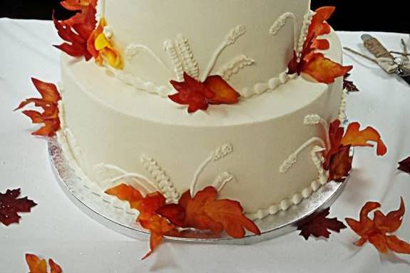 All buttercream cake with 100% edible leaves made from wafer paper and edible airbrush coloring