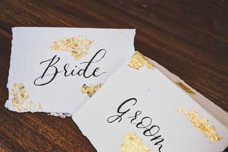 Handcrafted place cards with gold leafing
