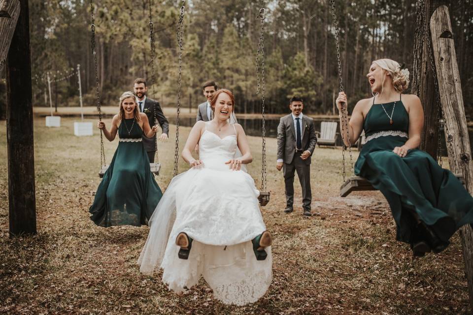 Bride swinging with her girls
