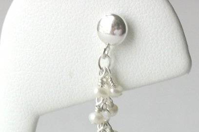Luscious freshwater pearls create a simple,
yet elegant bridal earring.
Materials:  Freshwater pearls,
sterling silver
Size:  From top of earwire,
1 1/2