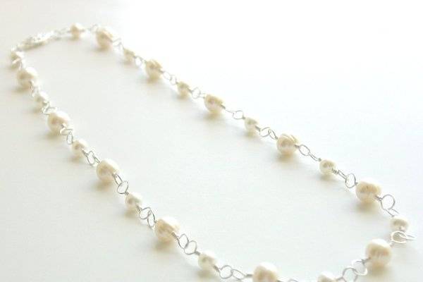 For the classic bride.
Materials:  Freshwater pearls (two sizes),
sterling silver findings
Size:  16