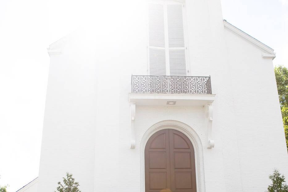 Couple standing in front of a church