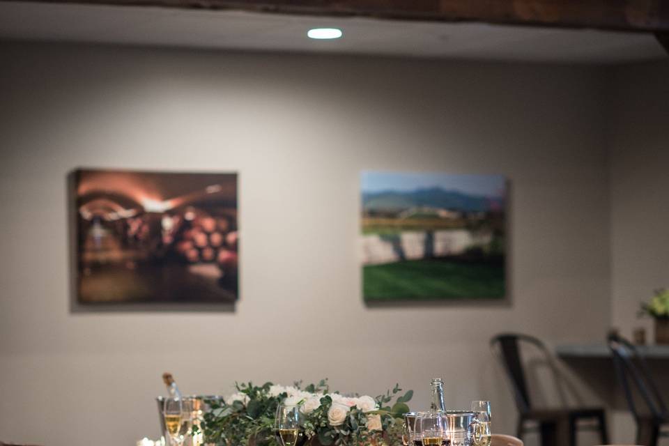 Dining table setup with fruits and vegetable on the center