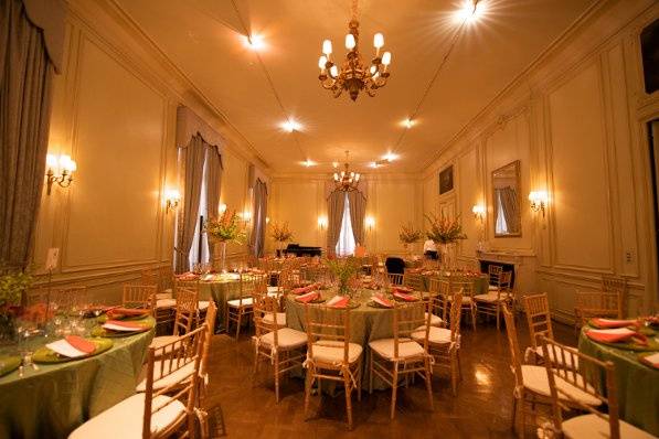 The Drawing Room seats up to 100 guests, and connects to the Library for additional seating.  Candles enclosed in glass are permitted -- and encouraged! -- adding dramatic ambiance.  (Photo by Stacey Vaeth Photography)