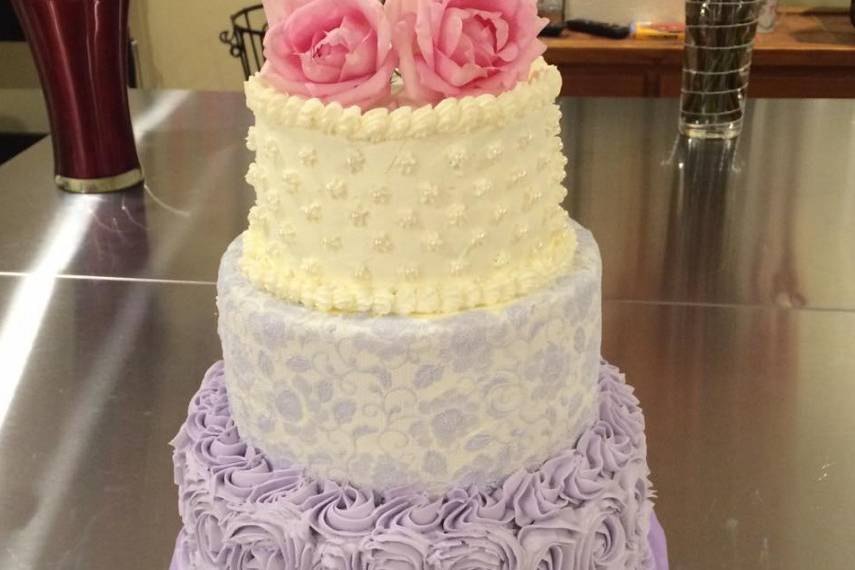 Lavender Wedding cake with rosettes and edible lace
