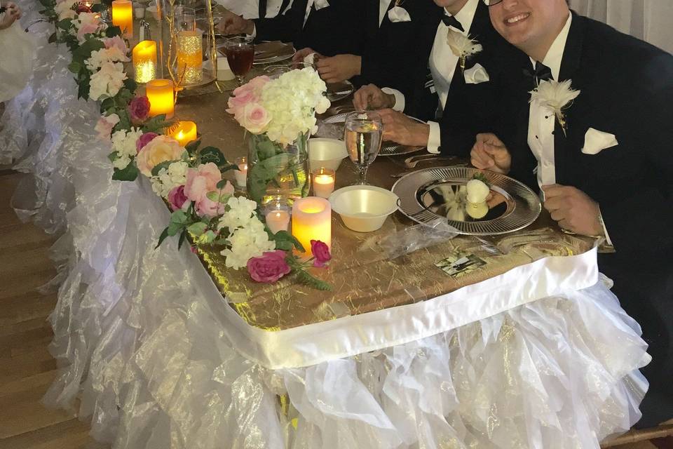 The couple with their groomsmen and bridesmaids