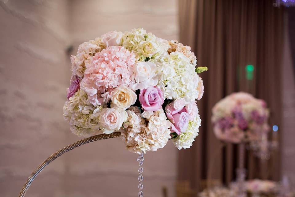 Our Signature Half Moon Stands make a stunning centerpiece.  We also had to add some bling with crystal chandeliers