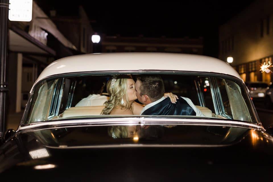 Newlyweds kissing - Milisa Pickett Photography