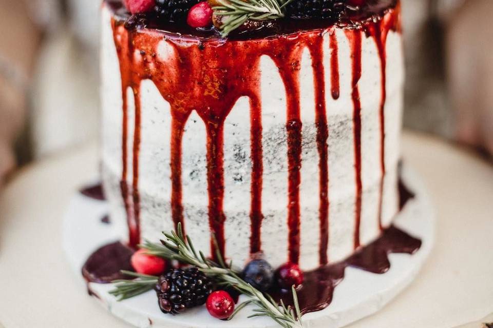 Cake with dripping berry sauce