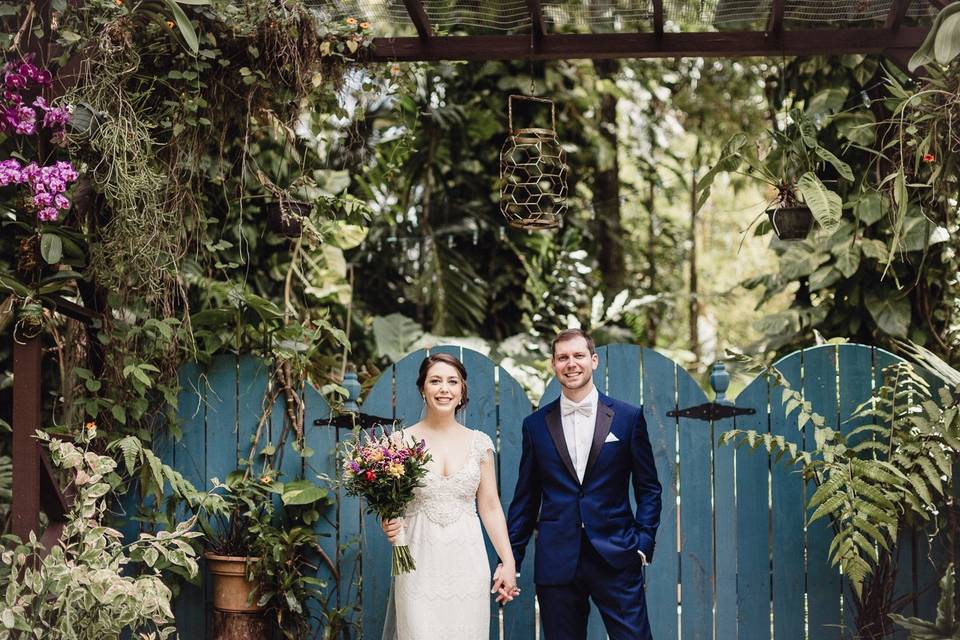 A couple surrounded by luscious greenery