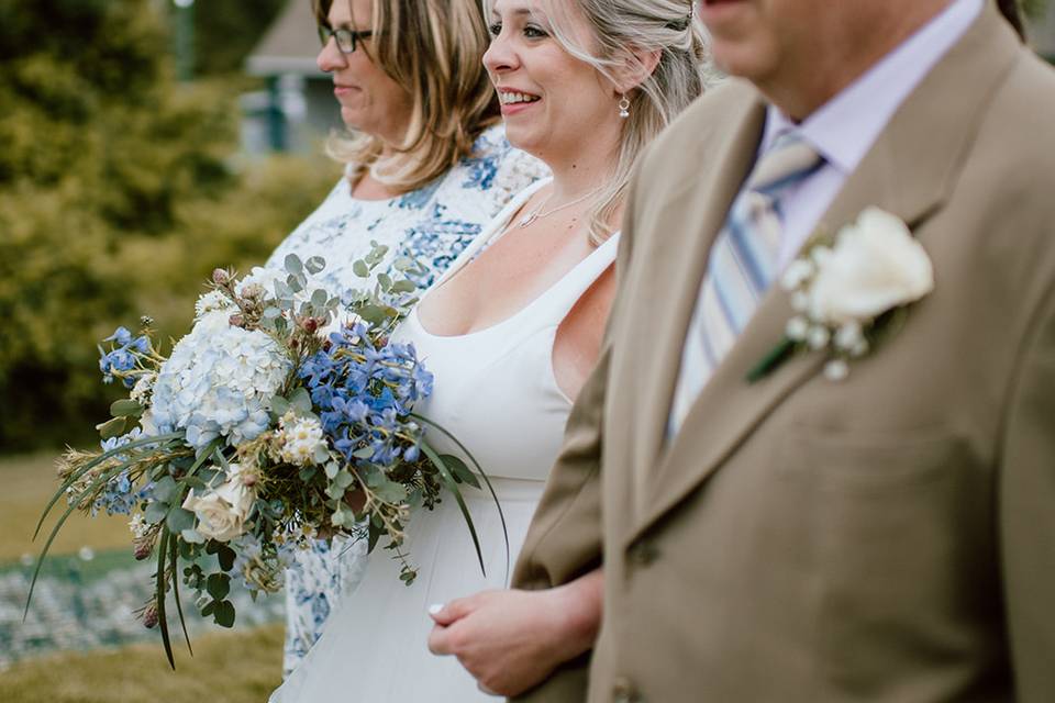 Mom, Bride, and Dad Walking