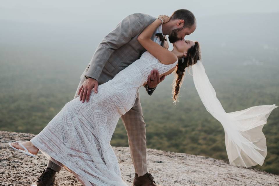 A dip between bride and groom