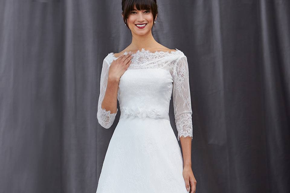 FAITH
A traditional lace a-line gown with a removable 3/4 sleeve jacket.