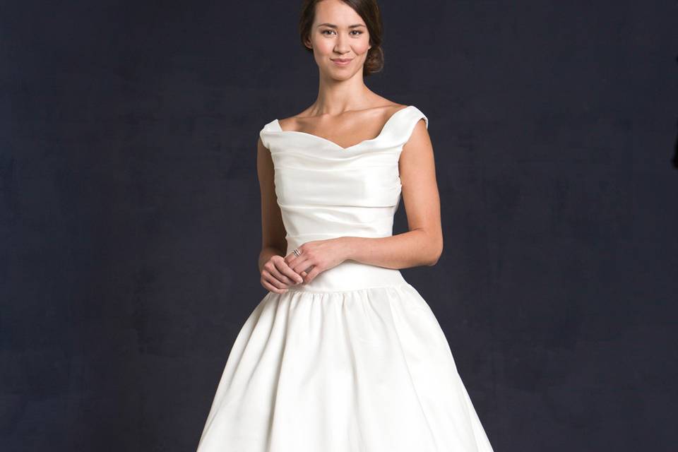 Lis Simon Style:  GILMORE
Mikado fabric - pleated bodice with straps, scoop neckline, elongated bodice with full ball gown skirt.  Pockets included.