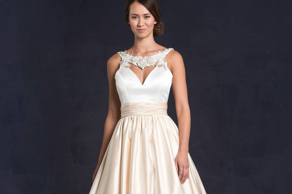 Lis Simon Style:  GRETEL
Embroidered & crystal bateau neckline with satin bodice & satin gathered full A-line skirt with pockets.  Open back with zipper.