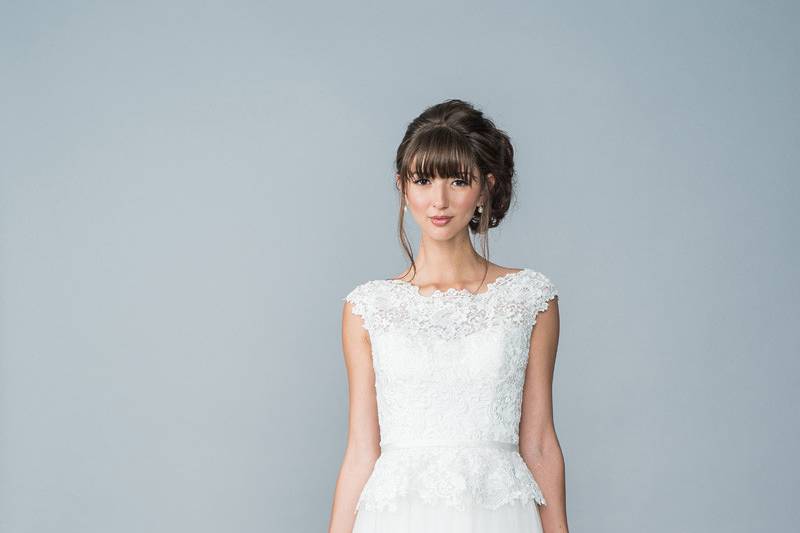 Style Harlow <br> This gown has a beautiful lace jewel neckline and a statement open v-back. 