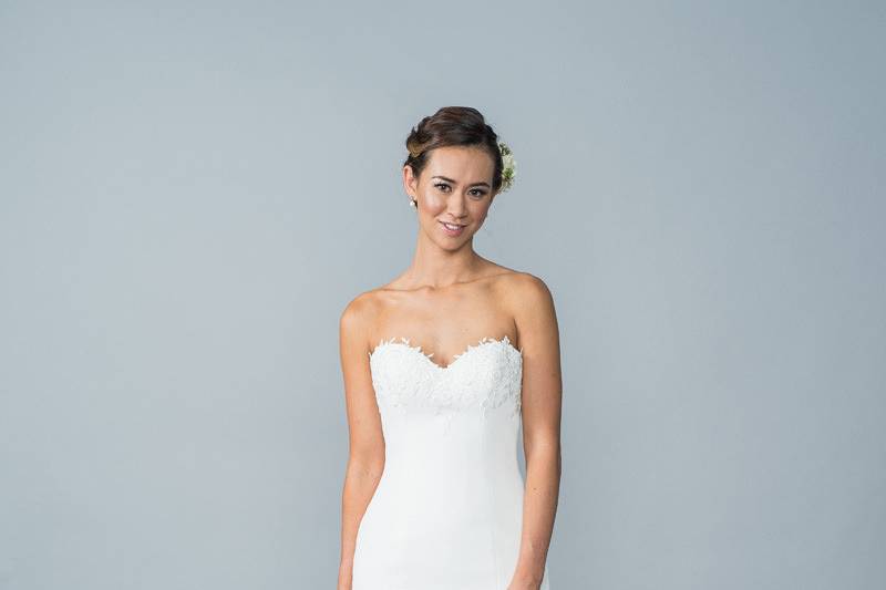 Style Hattie <br> This classic gown classic gown has a crepe bodice with beautiful delicate lace appliqué detail.