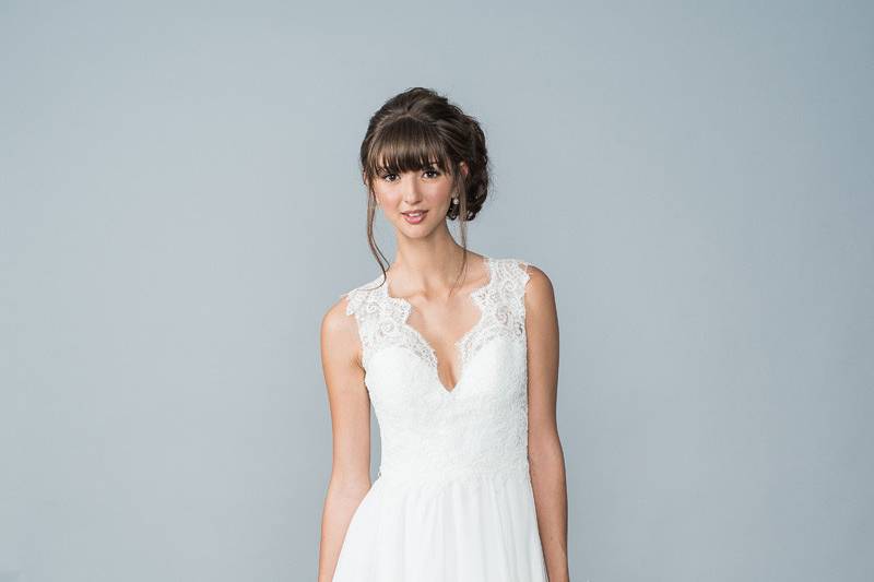 Style Hayden <br> Hayden is a romantic gown that has a sweetheart neckline, illusion lace sleeves, laced bodice and chiffon A-Line skirt. 