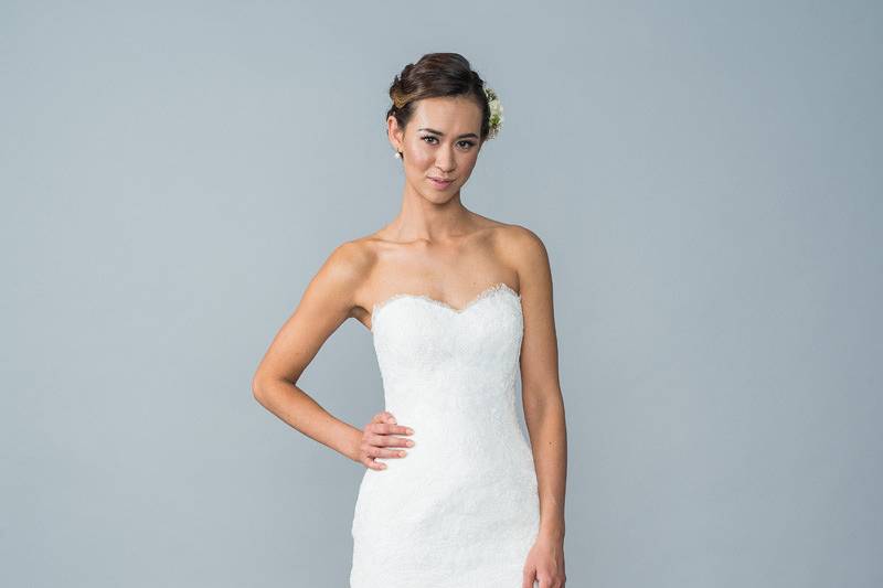 Style Hewitt <br> A strapless gown with a sweetheart neckline, fit and flare skirt and finished off with fabric buttons and a zipper back. 