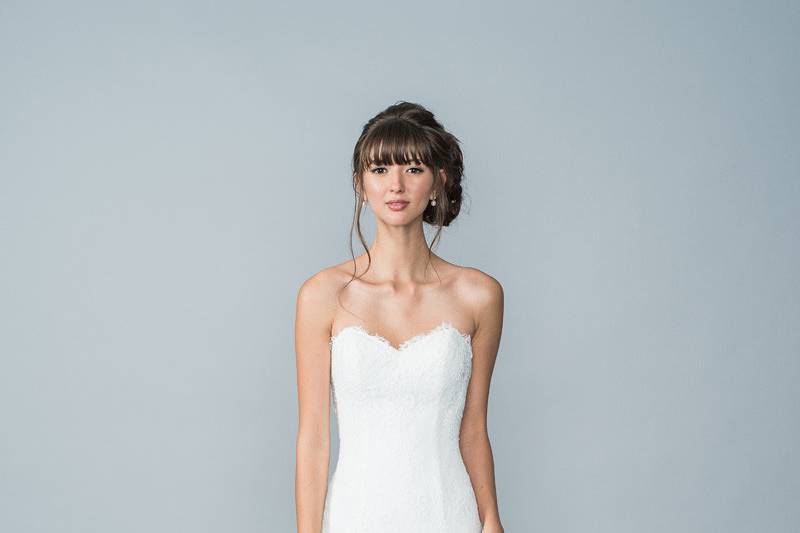 Style Hyatt <br> Soft lace gown with a sweetheart neckline, elongated bodice with soft a-line skirt, fabric buttons and a zipper skirt. 