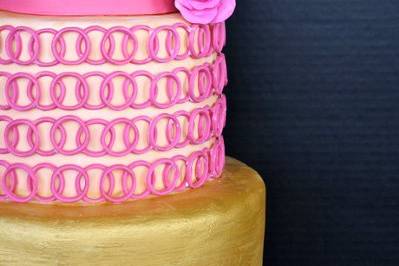 gold and pink wedding cake