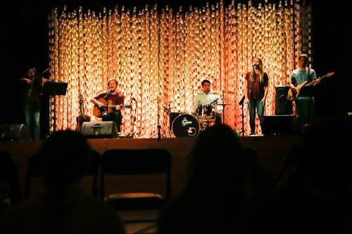 Band playing onstage inside The Lampost Warehouse