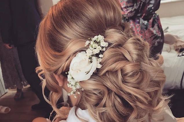 Updo with curls and flowers