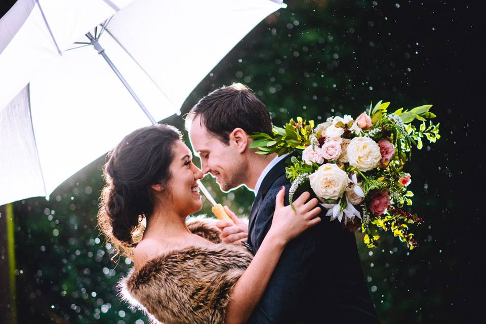 Bride and groom in the rain