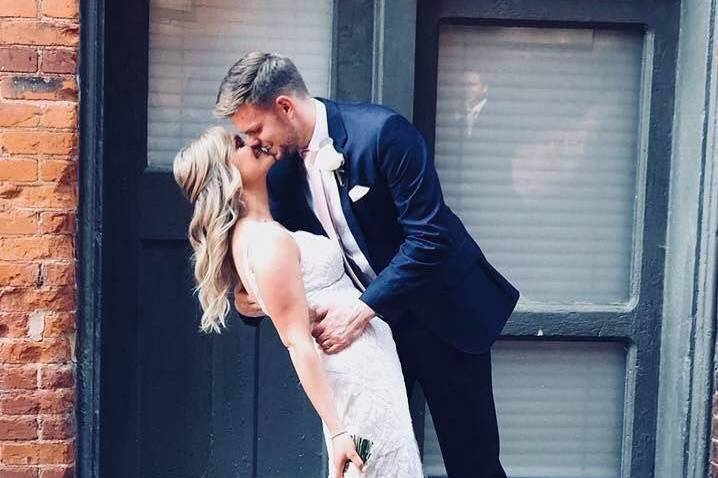 Groom kisses his bride