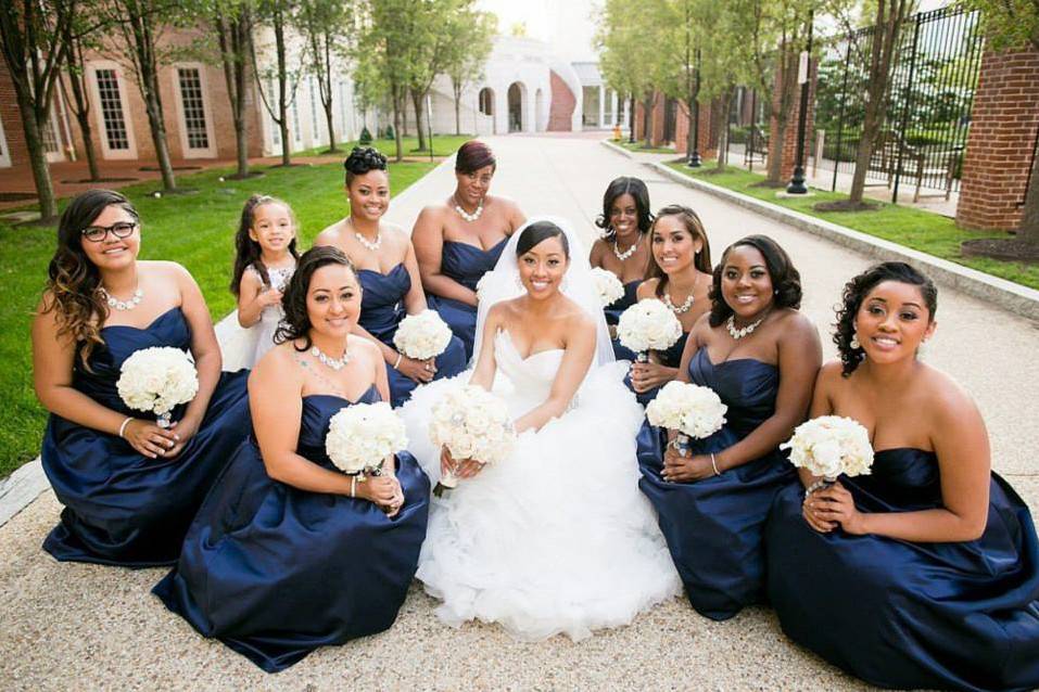 Bride and her bridesmaids sitting down