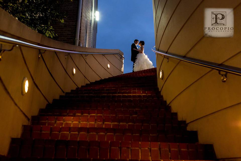 Newlyweds at the top of the stairs