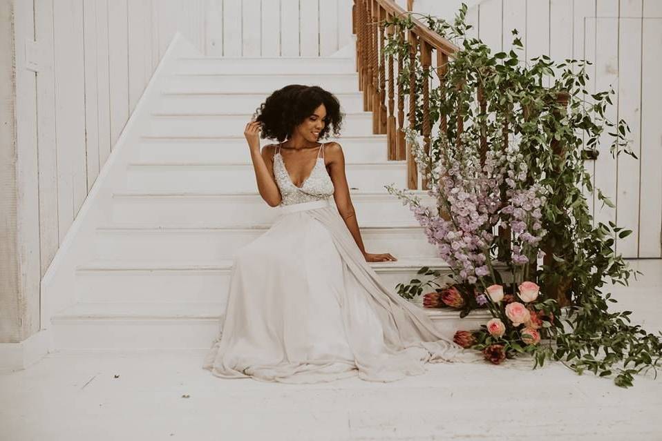 Bride on stairs with floral decor