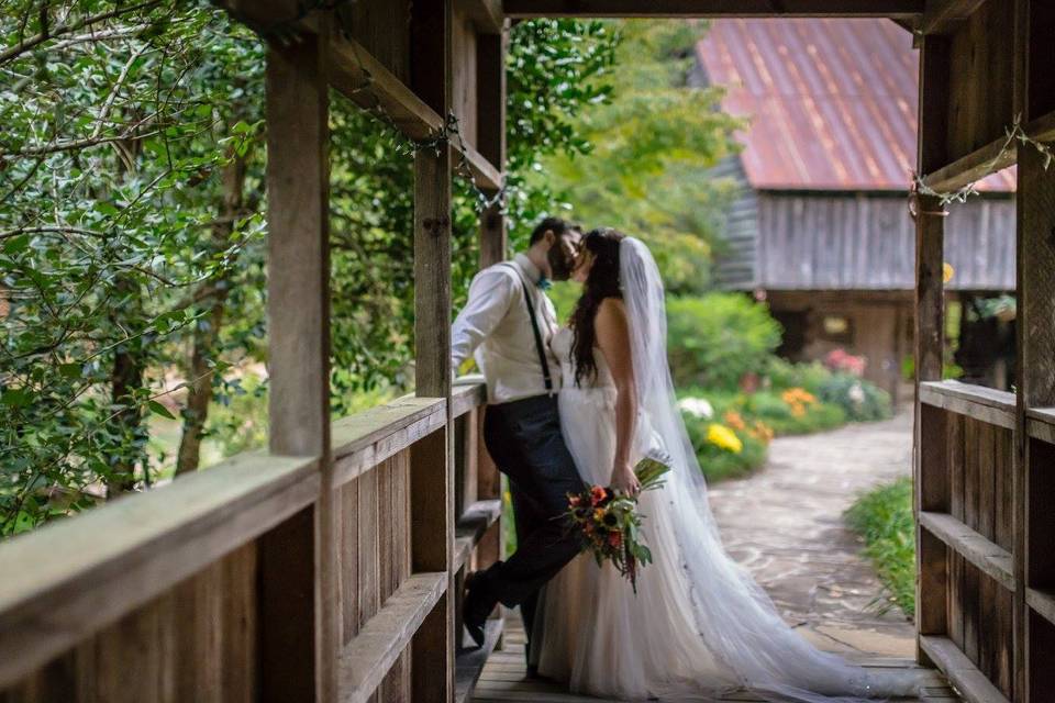 Couple kissing in the barn