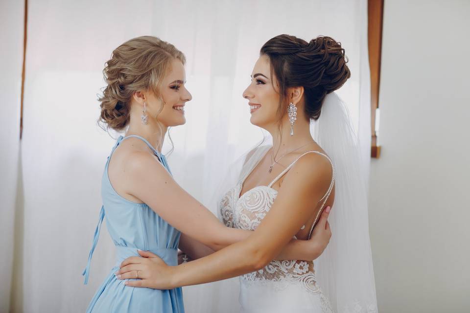 Bride and bridesmaid moment