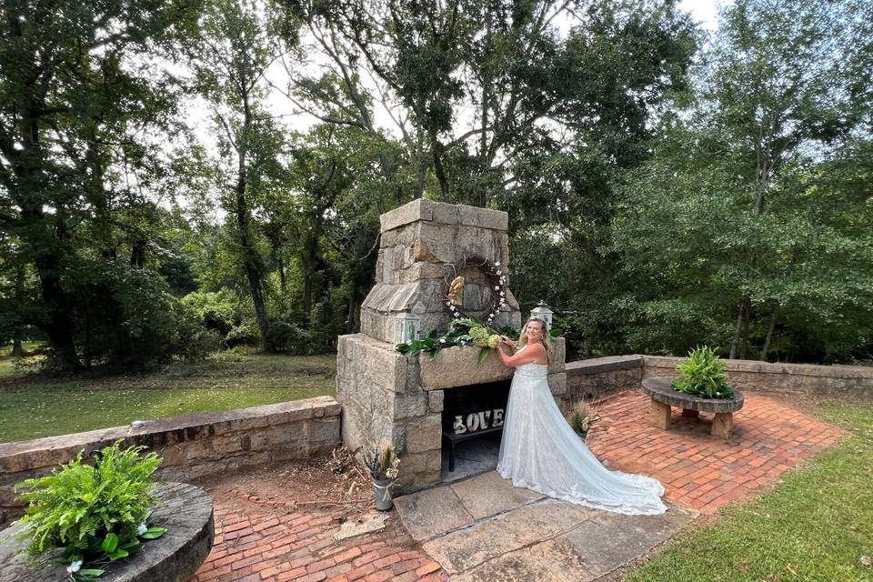 Bride at fireplace