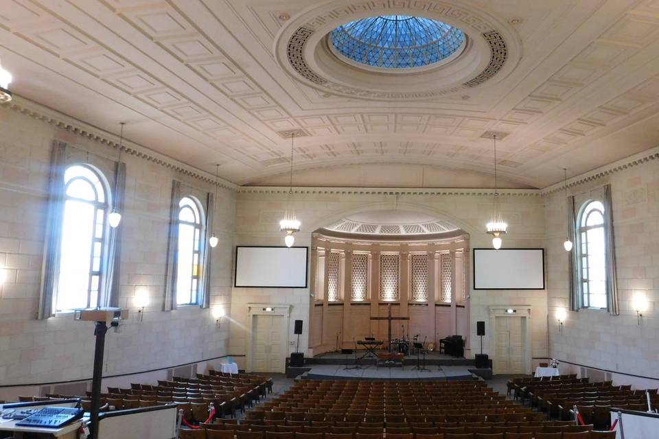 Main sanctuary with arched windows and domed skylight