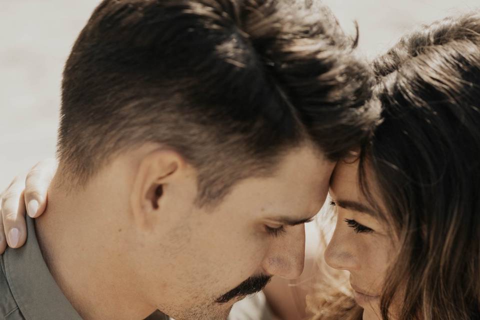 Couple sitting on sand