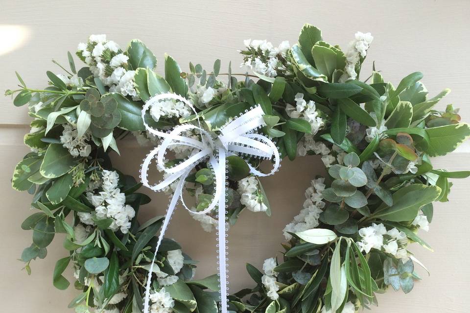 Fresh Heart Shaped Wreath with pittosporum, eucalyptus, lemon leaf, and white statice.