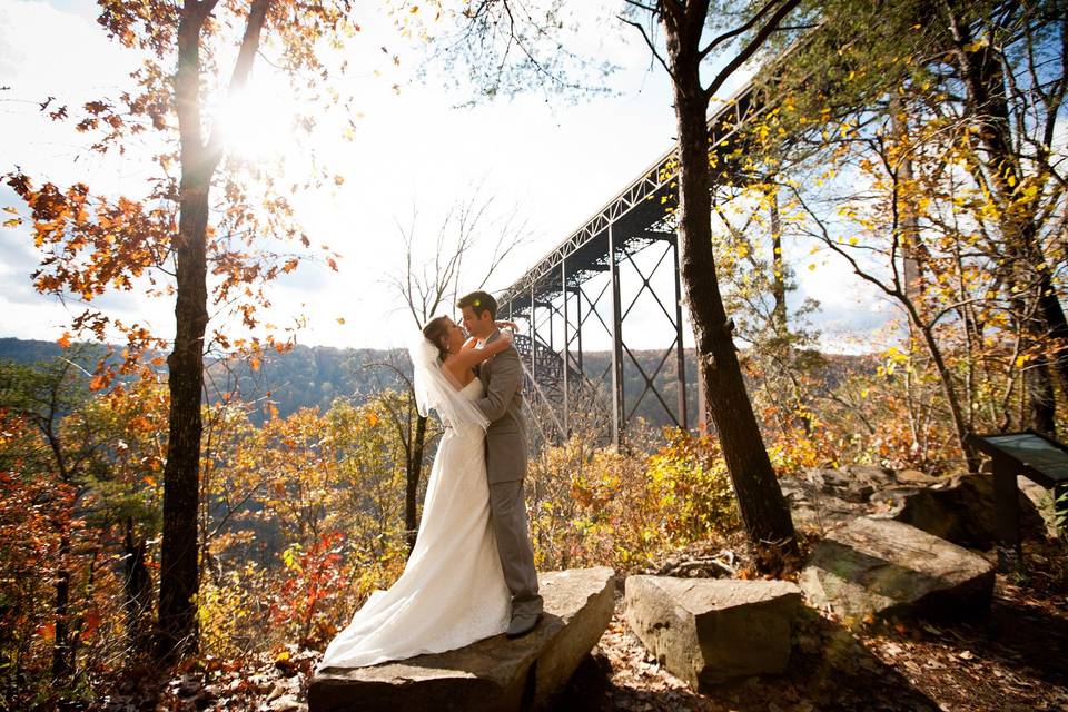 Couple kiss by the train tracks