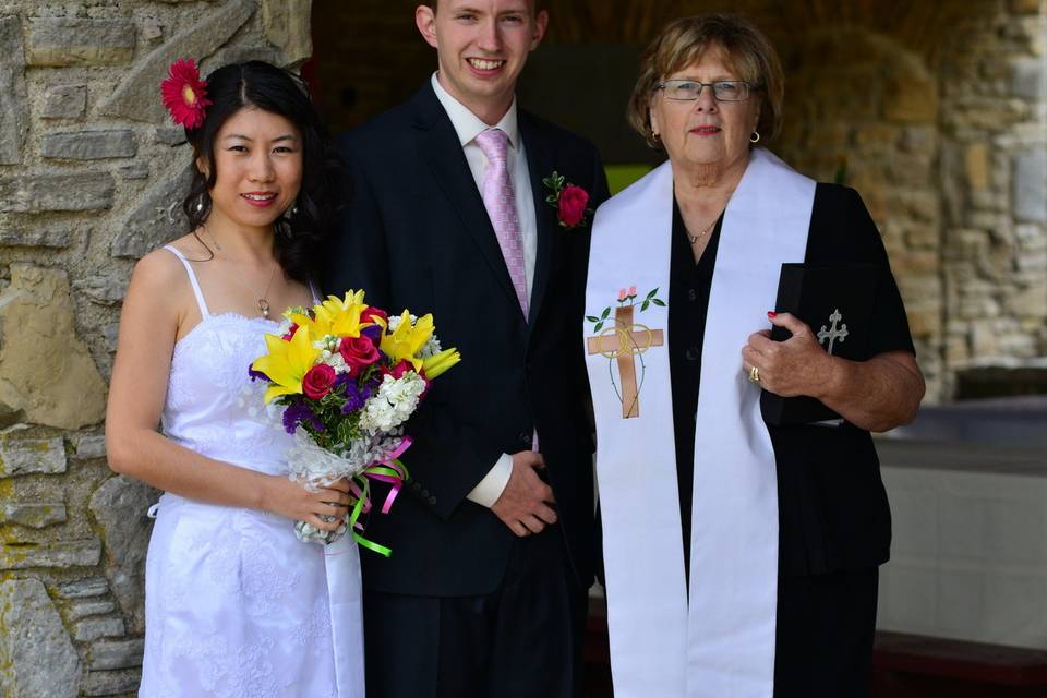 Newlyweds with the reverend