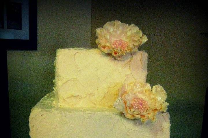 3 tier textured buttercream cake with gumpaste flowers