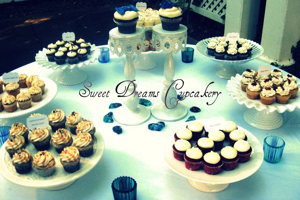 Garden wedding cupcake display, with custom Bride & Groom cupakes