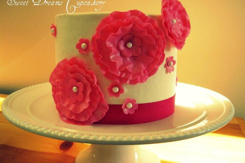 Wedding cutting cake with frilly fondant flowers