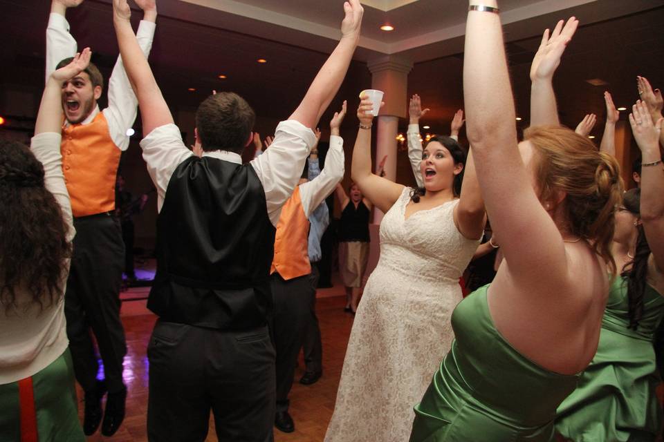 Newlyweds and their guests dancing