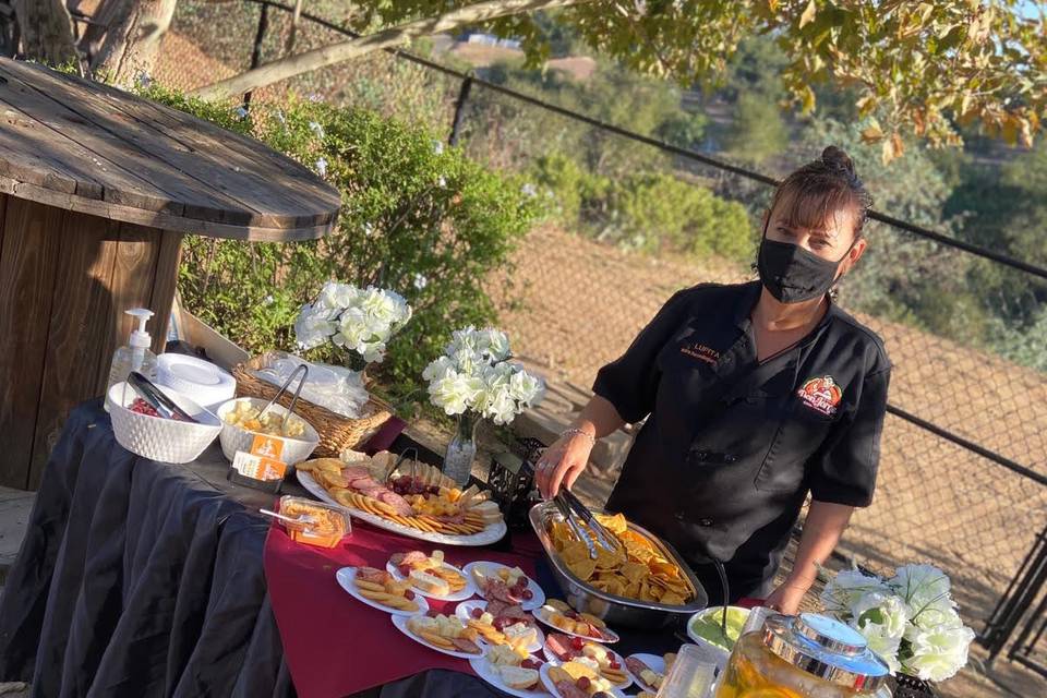 Lupita at appetizer table