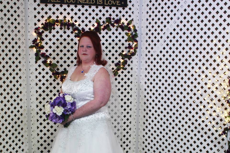 Bridal portrait in front of backdrop
