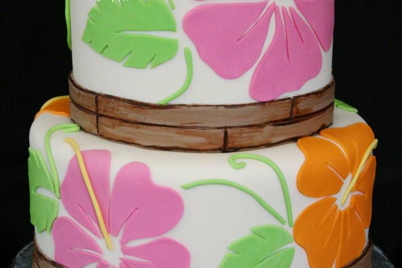 Perfect for a destination or beach-themed wedding with tropical flowers and an edible bamboo border.