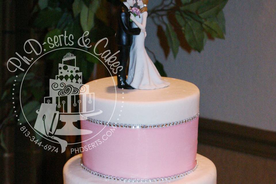 An all-buttercream cake with large pink ribbon and faux diamonds to add just the right amount of bling!